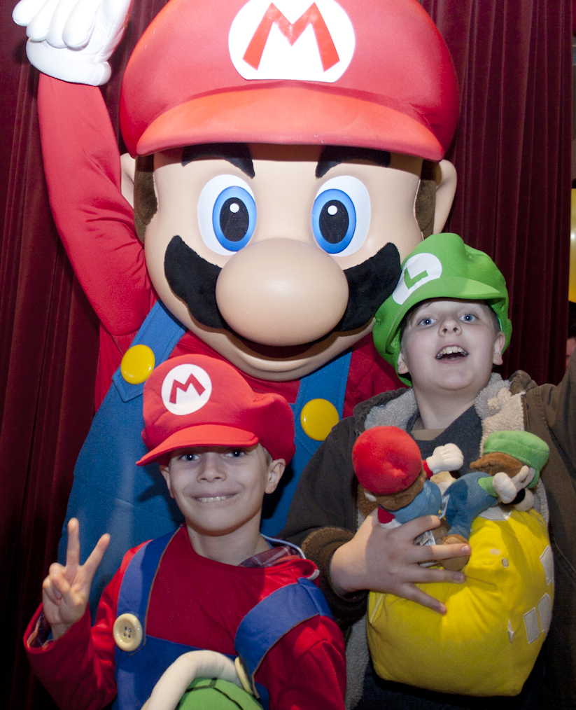 This happy fan was the first to win a Mario Party TM 9 bundle this past weekend at the Mario Party 9 Launch Party. Loyal fans, young and old, partied with the legendary Nintendo character at the Hard Rock Cafe. 